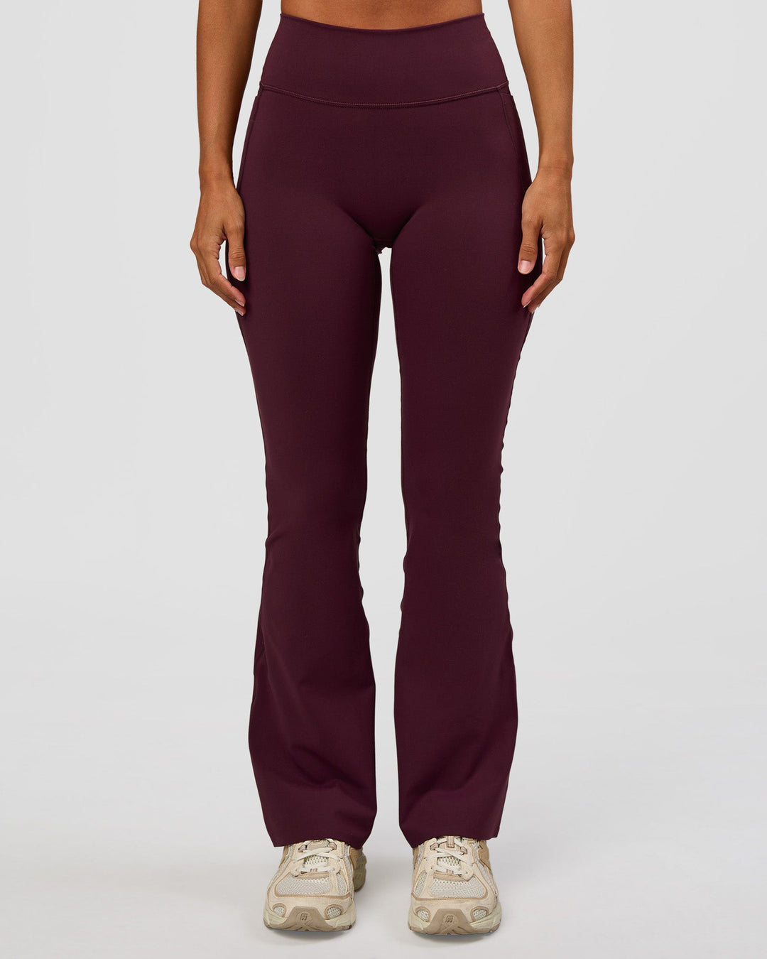 Woman wearing Fusion V-Contour High-Rise Flared Petite Legging Pockets - Cherry Lacquer | Model:Brylee | Size:XS - view 11