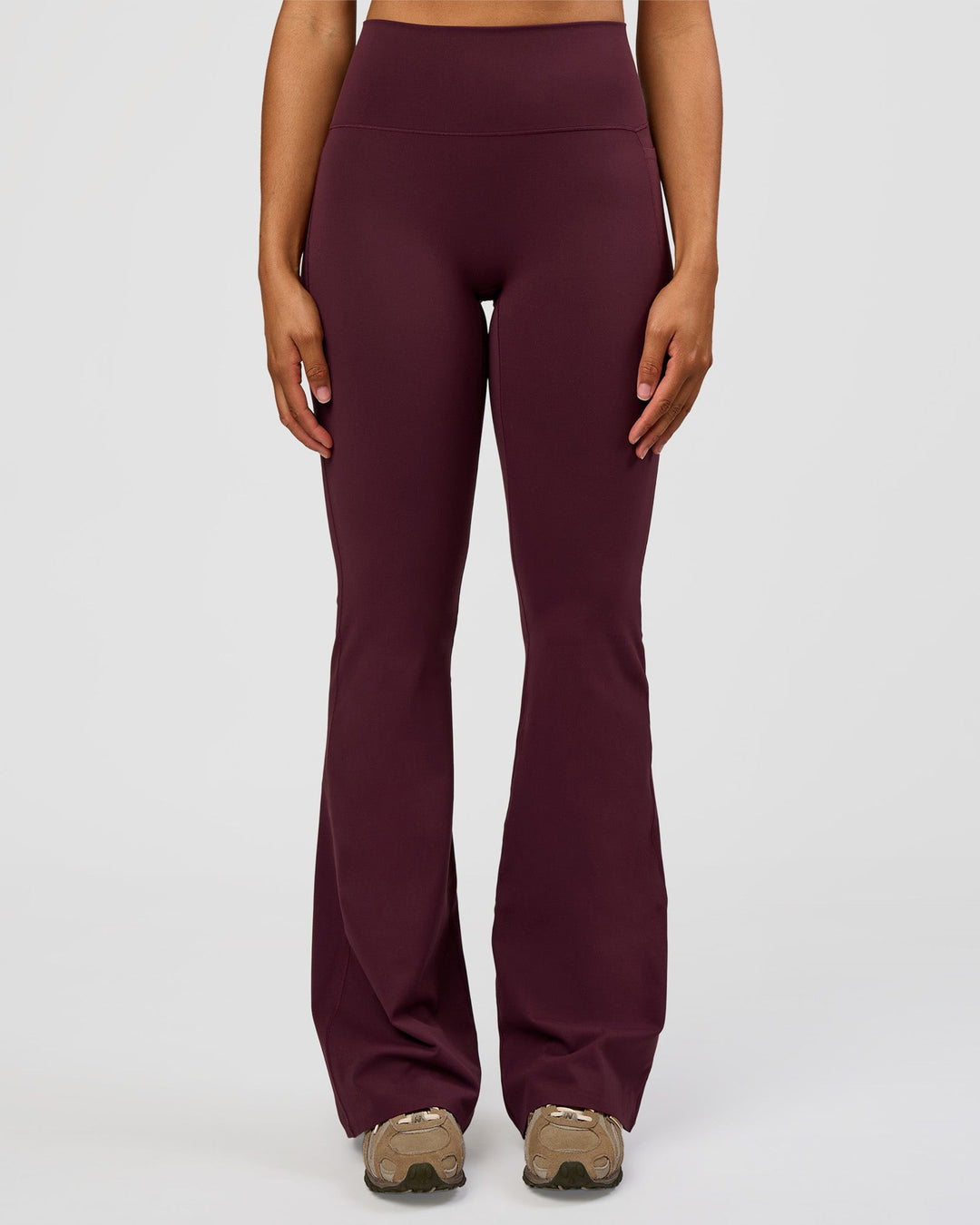 Woman wearing Fusion V-Contour High-Rise Flared Tall Legging Pockets - Cherry Lacquer | Model:Rosie | Size:S