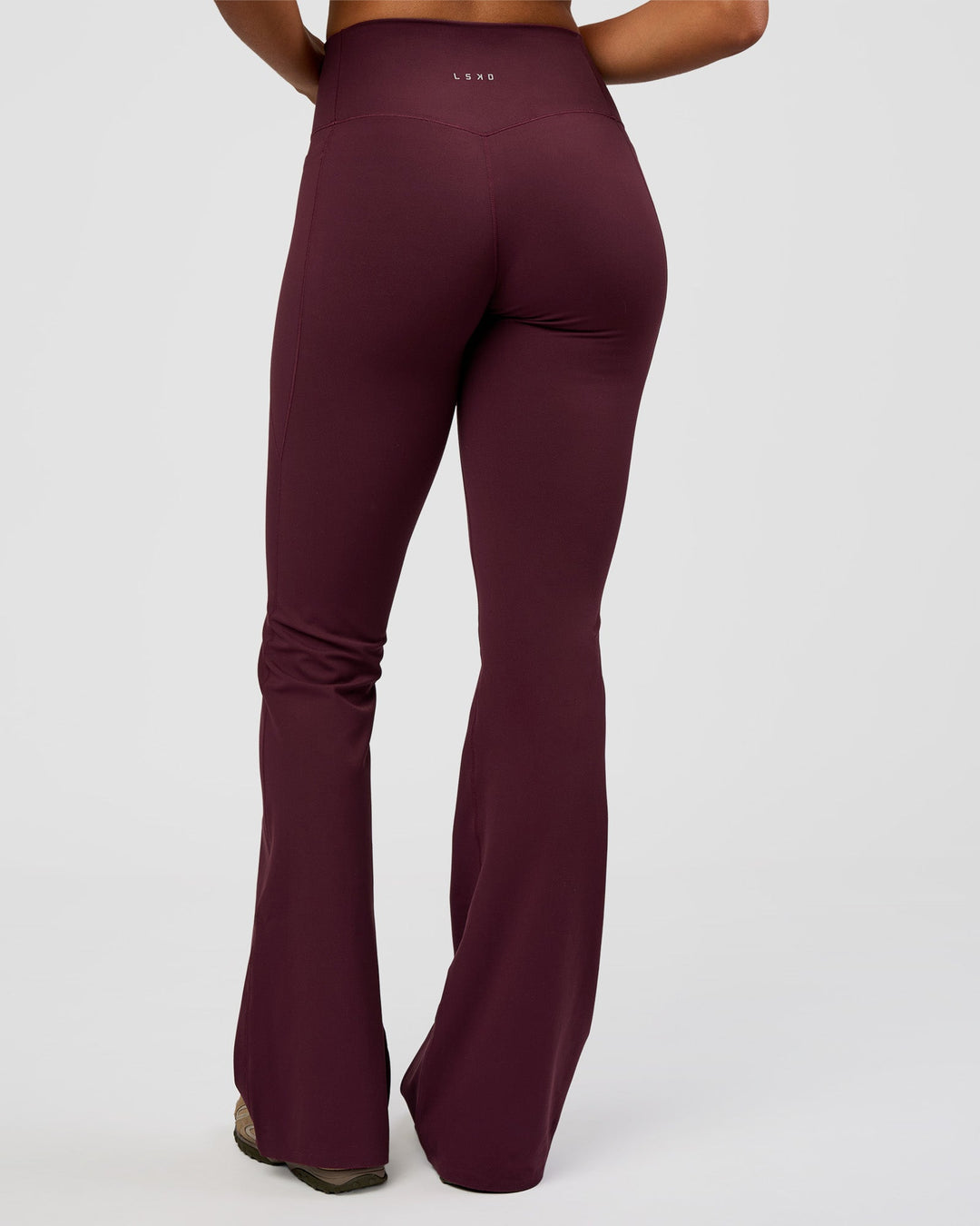 Woman wearing Fusion V-Contour High-Rise Flared Tall Legging Pockets - Cherry Lacquer | Model:Rosie | Size:S - view 5
