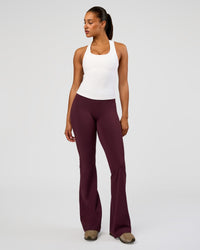 Woman wearing Fusion V-Contour High-Rise Flared Tall Legging Pockets - Cherry Lacquer | Model:Rosie | Size:S | Thumbnail Index: 5