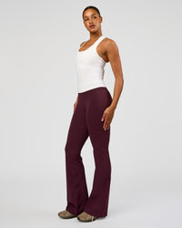 Woman wearing Fusion V-Contour High-Rise Flared Tall Legging Pockets - Cherry Lacquer | Model:Rosie | Size:S | Thumbnail Index: 6