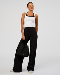 Woman wearing Fusion V-Contour High-Rise Pant - Black | Model:Charli | Size:XS