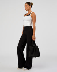 Woman wearing Fusion V-Contour High-Rise Pant - Black | Model:Charli | Size:XS