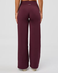 Woman wearing Fusion V-Contour High-Rise Petite Pant - Cherry Lacquer | Model:Issy | Size:XS