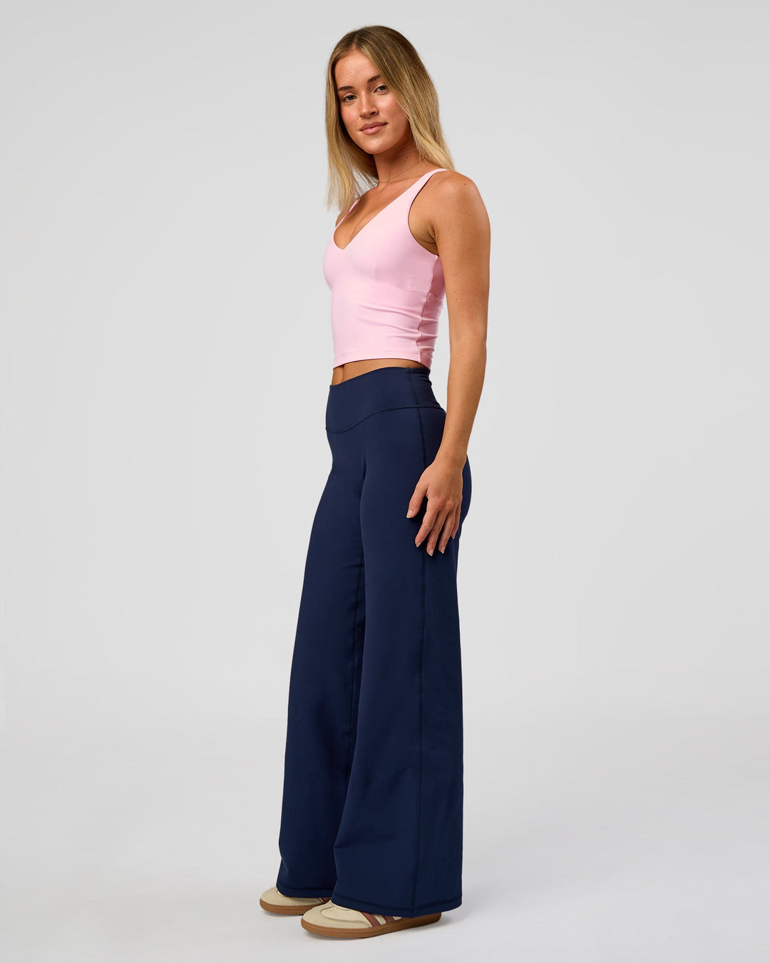 Model wearing Fusion V-Contour High-Rise Petite Pant - Future Navy | Model:Issy | Size:XS