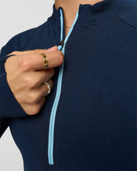 Woman wearing GG AeroFLX+ Long Sleeve Half Zip - Future Navy-Baltic Sea | Model:Grace | Size:XS | Thumbnail Index: 7