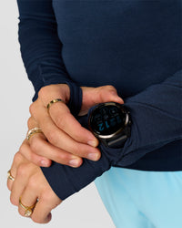 Woman wearing GG AeroFLX+ Long Sleeve Half Zip - Future Navy-Baltic Sea | Model:Grace | Size:XS | Thumbnail Index: 9