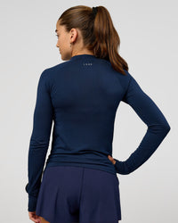 Woman wearing GG AeroFLX+ Long Sleeve Half Zip - Future Navy-Baltic Sea | Model:Grace | Size:XS | Thumbnail Index: 3