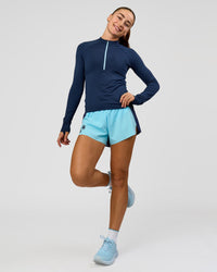 Woman wearing GG AeroFLX+ Long Sleeve Half Zip - Future Navy-Baltic Sea | Model:Grace | Size:XS | Thumbnail Index: 2