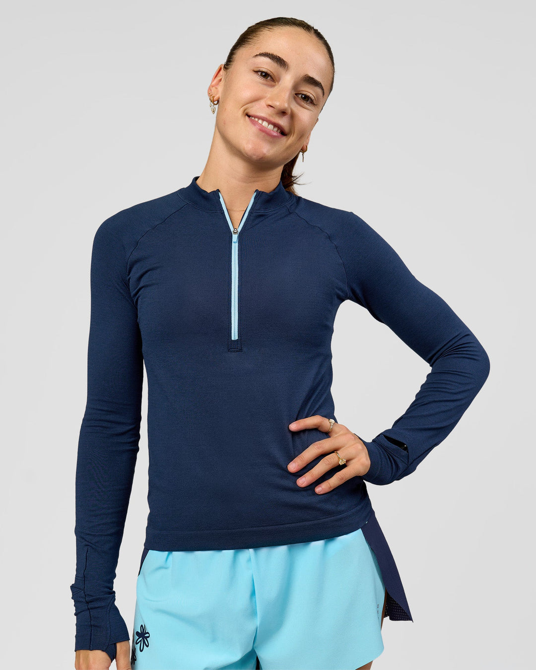Woman wearing GG AeroFLX+ Long Sleeve Half Zip - Future Navy-Baltic Sea | Model:Grace | Size:XS - view 7
