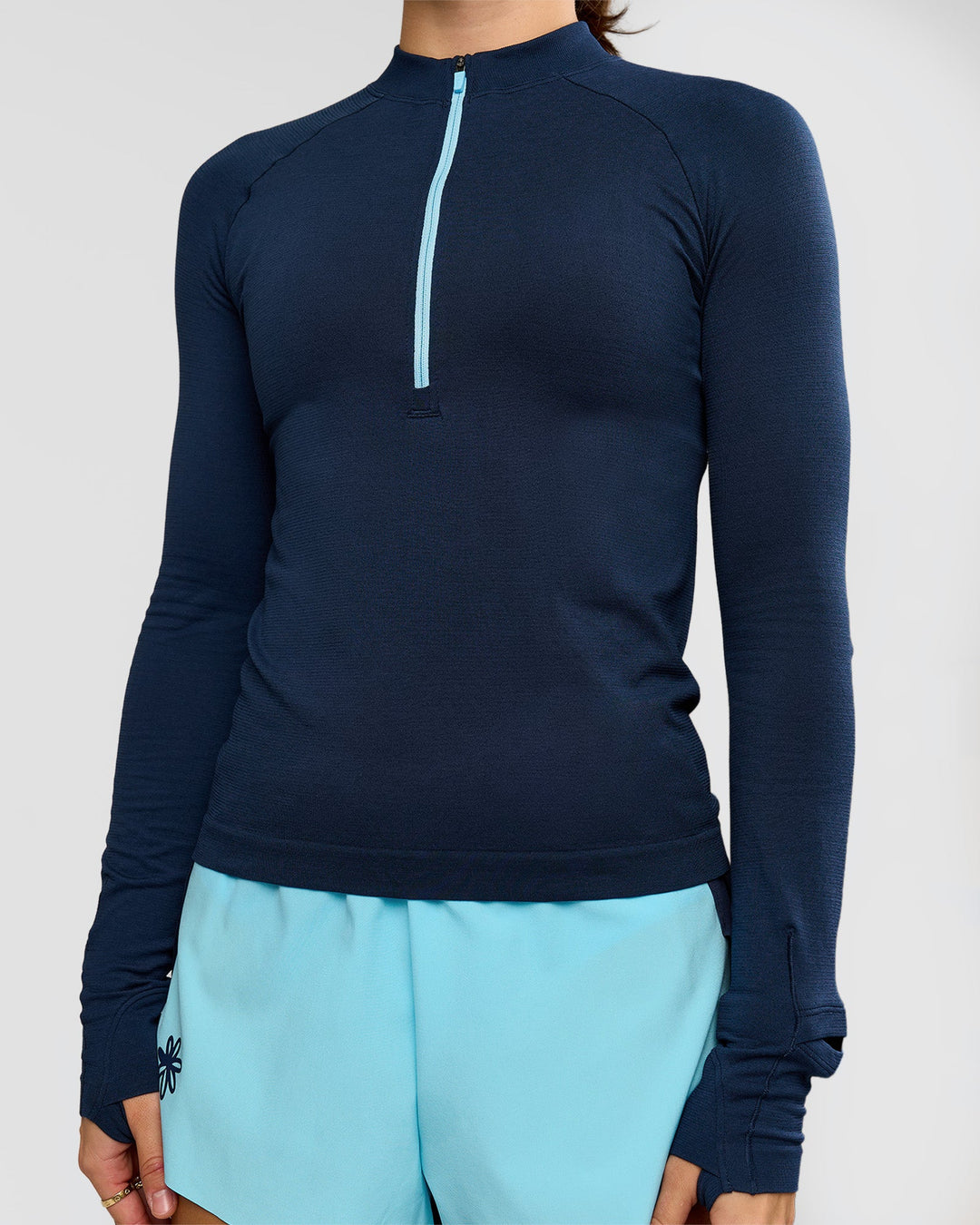 Woman wearing GG AeroFLX+ Long Sleeve Half Zip - Future Navy-Baltic Sea | Model:Grace | Size:XS - view 11