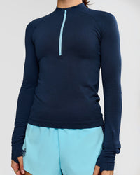 Woman wearing GG AeroFLX+ Long Sleeve Half Zip - Future Navy-Baltic Sea | Model:Grace | Size:XS | Thumbnail Index: 10