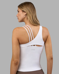 Woman wearing Galvanise Splice Shelf Bra Tank - White | Model:Leilani | Size:XS | Thumbnail Index: 1