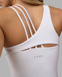 Woman wearing Galvanise Splice Shelf Bra Tank - White | Model:Leilani | Size:XS | Thumbnail Index: 2