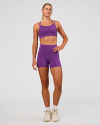 Woman wearing Genesis Layered Sports Bra - Fresh Purple | Model:Emelia | Size:XS