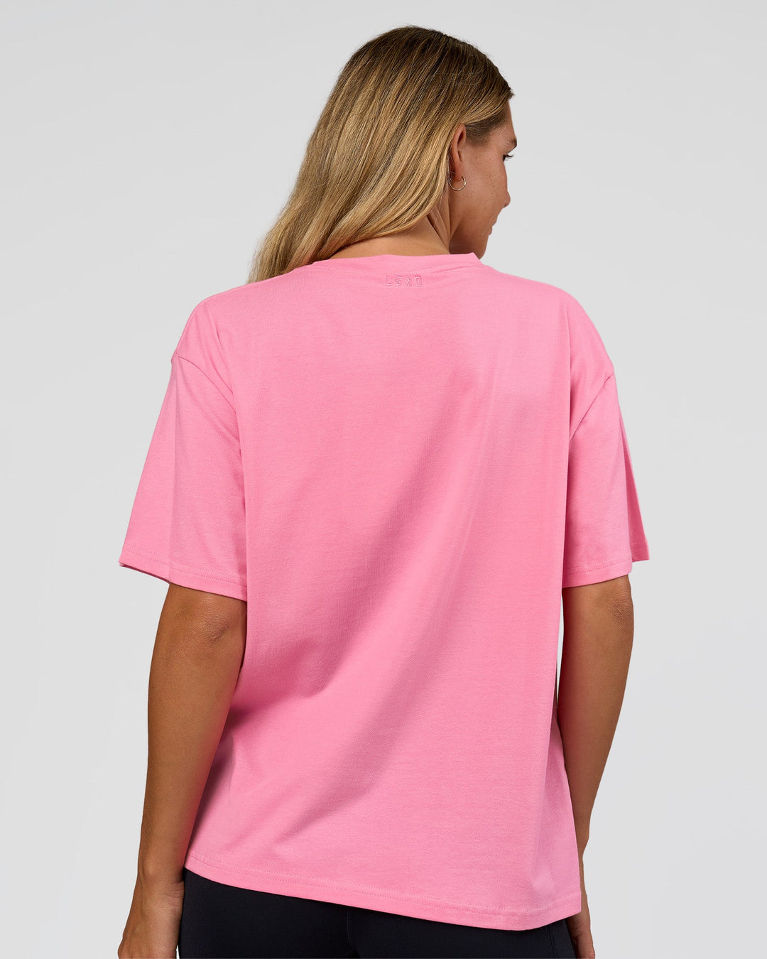 Woman wearing Go-To 1% Better Every Day FLXCotton Oversized Tee - Candy Pink-Black | Model:Amity | Size:XS - view 3