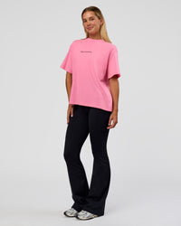Woman wearing Go-To 1% Better Every Day FLXCotton Oversized Tee - Candy Pink-Black | Model:Amity | Size:XS | Thumbnail Index: 5