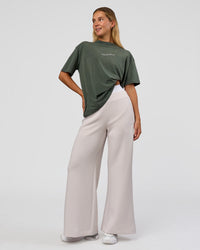 Woman wearing Go-To 1% Better Every Day FLXCotton Oversized Tee - Carbon Green Washed-White | Model:Amity | Size:XS | Thumbnail Index: 6