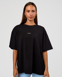 Woman wearing Go-To Break Through FLXCotton Oversized Tee - Black-Open Air | Model:Brylee | Size:XS | Thumbnail Index: 2