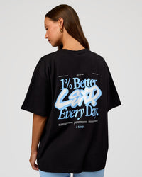 Woman wearing Go-To Break Through FLXCotton Oversized Tee - Black-Open Air | Model:Brylee | Size:XS | Thumbnail Index: 0