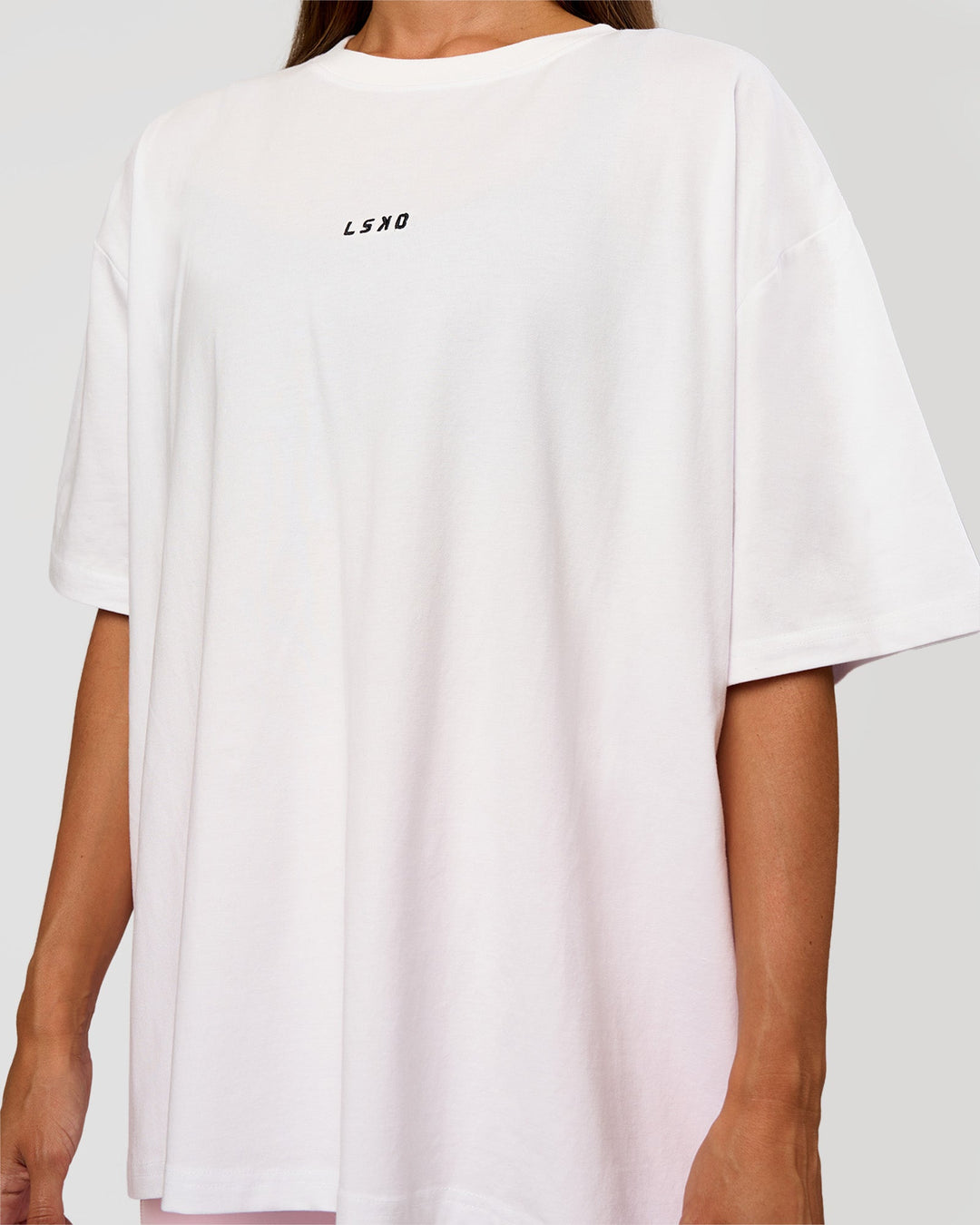Woman wearing Go-To Break Through FLXCotton Oversized Tee - White-Marshmallow | Model:Brylee | Size:XS - view 4