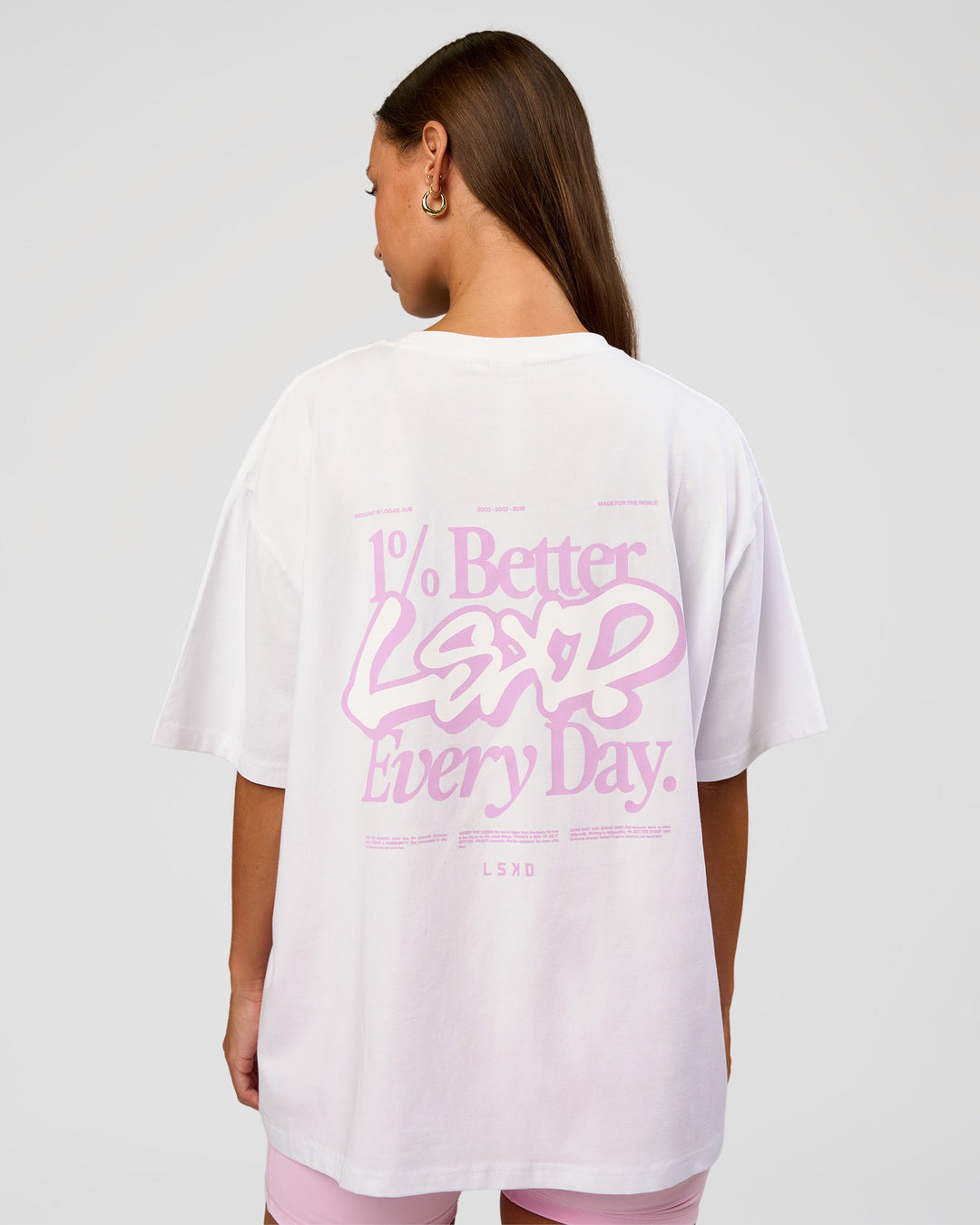 Woman wearing Go-To Break Through FLXCotton Oversized Tee - White-Marshmallow | Model:Brylee | Size:XS - view 1