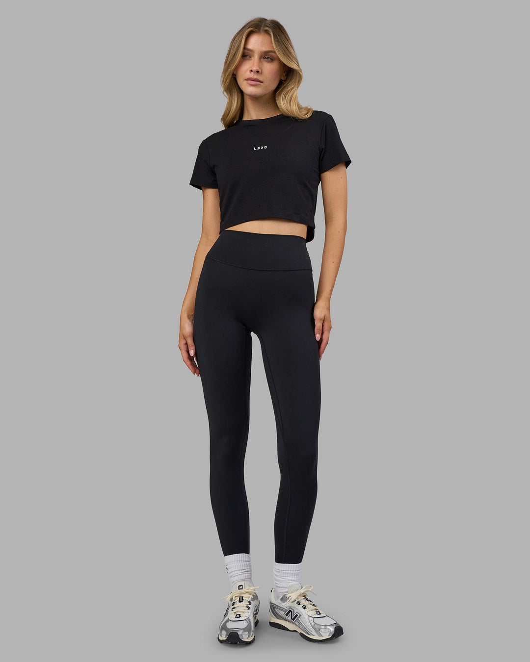 Woman wearing Go-To FLXCotton Baby Tee - Black-White | Model:Leilani | Size:XS