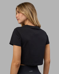 Woman wearing Go-To FLXCotton Baby Tee - Black-White | Model:Leilani | Size:XS | Thumbnail Index: 2