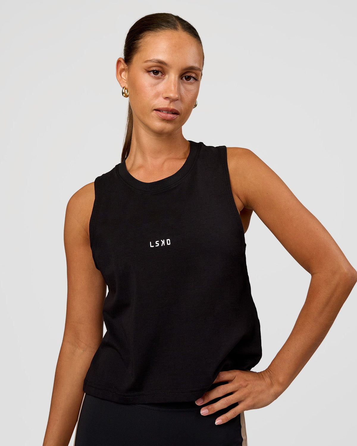 Woman wearing Go-To FLXCotton Midline Tank - Black-White | Model:Brylee | Size:XS - view 1