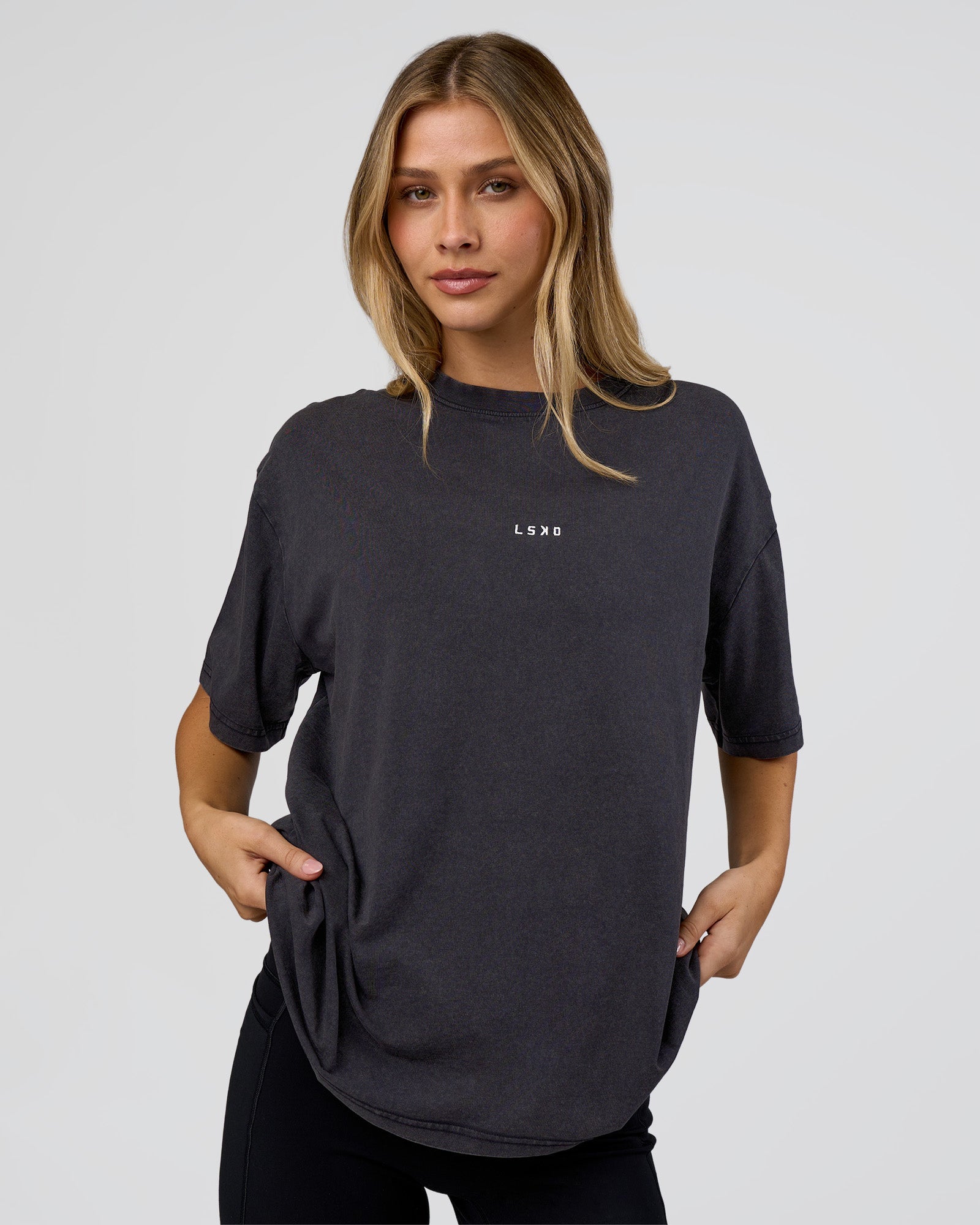 Woman wearing Go-To FLXCotton Oversized Tee - Black Washed-White | Model:Leilani | Size:S