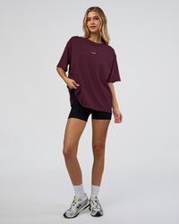 Woman wearing Go-To FLXCotton Oversized Tee - Cherry Lacquer-White | Model:Leilani | Size:XS | Thumbnail Index: 1