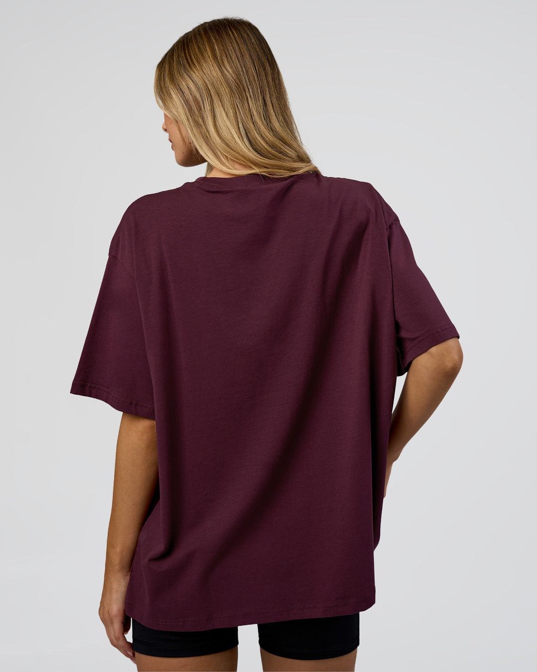 Woman wearing Go-To FLXCotton Oversized Tee - Cherry Lacquer-White | Model:Leilani | Size:XS - view 3