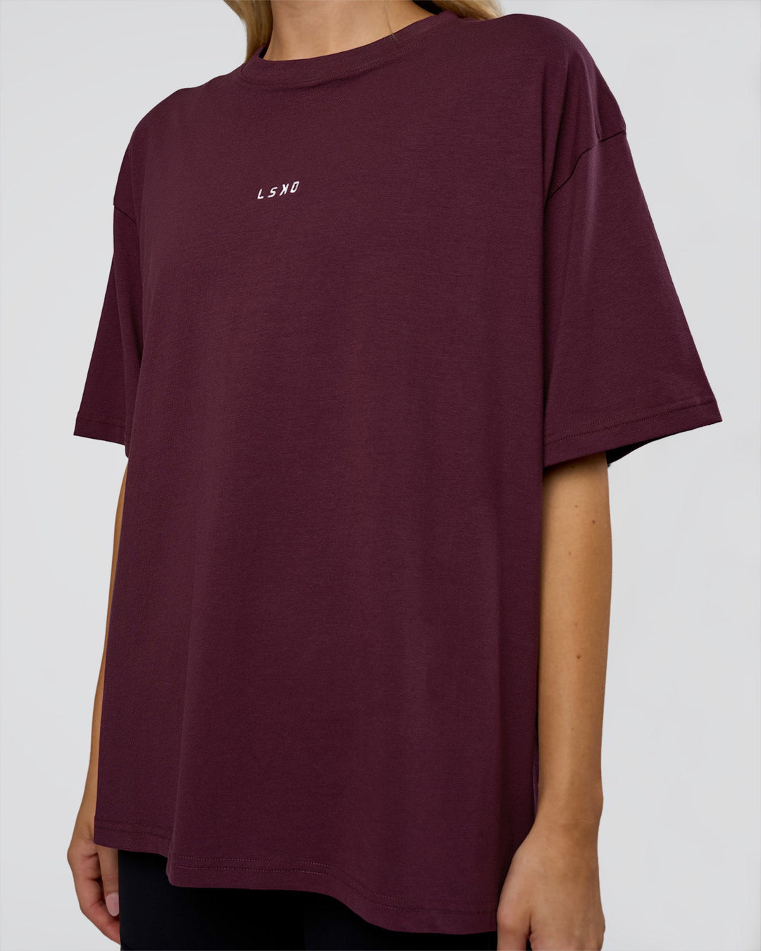 Woman wearing Go-To FLXCotton Oversized Tee - Cherry Lacquer-White | Model:Leilani | Size:XS - view 4