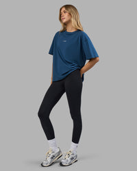 Woman wearing Go-To FLXCotton Oversized Tee - Indigo-White | Model:Leilani | Size:XS