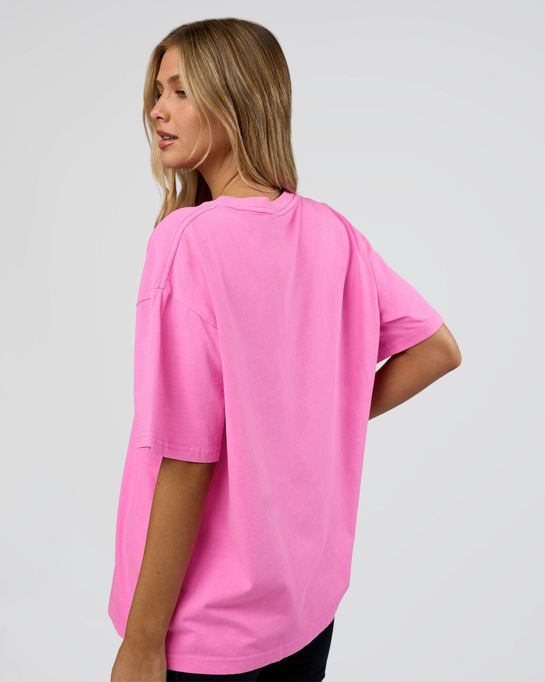 Woman wearing Go-To FLXCotton Oversized Tee - Ultra Fuchsia Washed | Model:Leilani | Size:XS