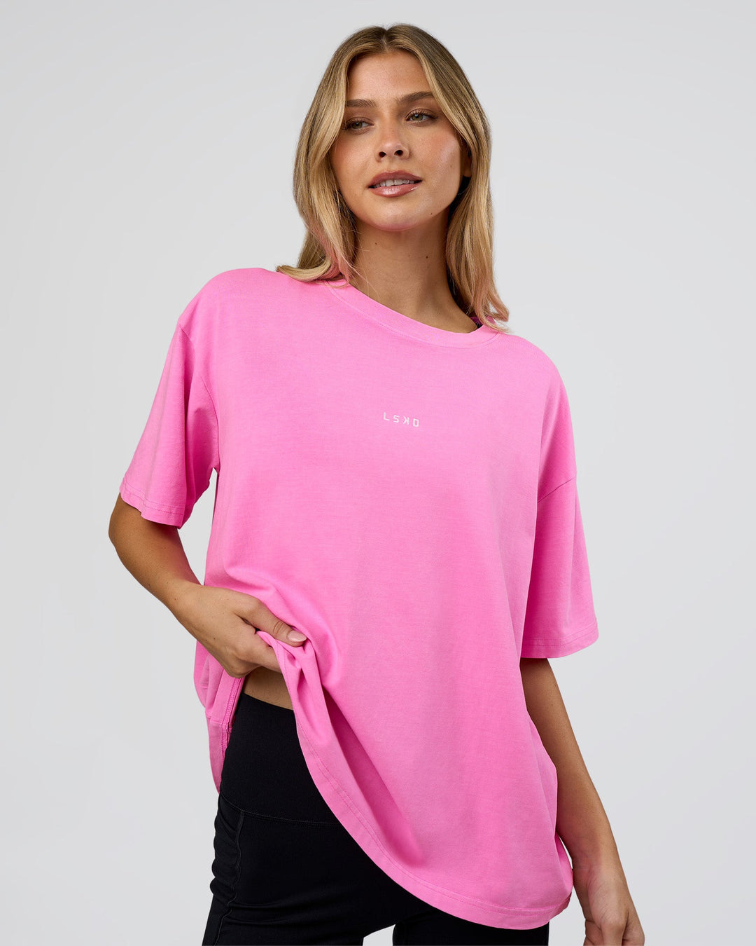 Woman wearing Go-To FLXCotton Oversized Tee - Ultra Fuchsia Washed | Model:Leilani | Size:XS