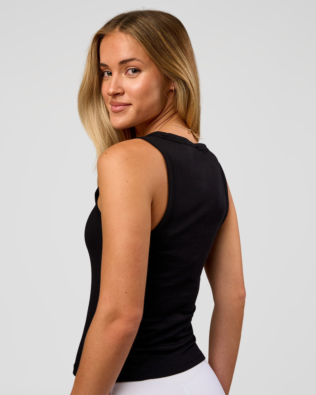 Woman wearing Go-To FLXCotton Scoop Neck Tank in Black-White | Model:Issy | Size:XS