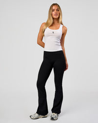 Woman wearing Go-To FLXCotton Scoop Neck Tank in White-Black | Model:Issy | Size:XS