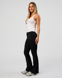 Woman wearing Go-To FLXCotton Scoop Neck Tank in White-Black | Model:Issy | Size:XS