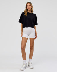 Woman wearing Go-To FLXCotton Skimmer Tee - Black-Black | Model:Leilani | Size:XS | Thumbnail Index: 1