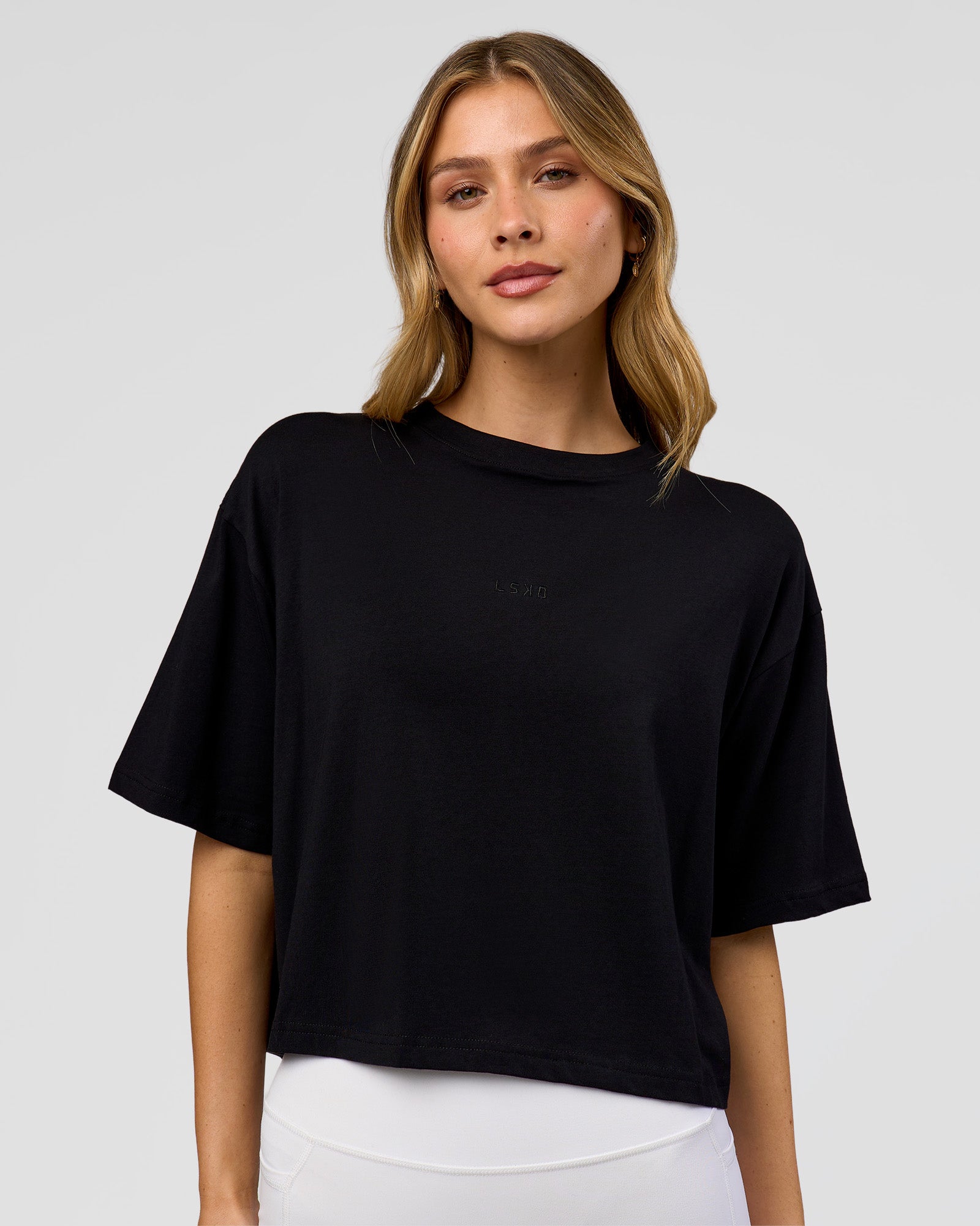 Woman wearing Go-To FLXCotton Skimmer Tee - Black-Black | Model:Leilani | Size:XS