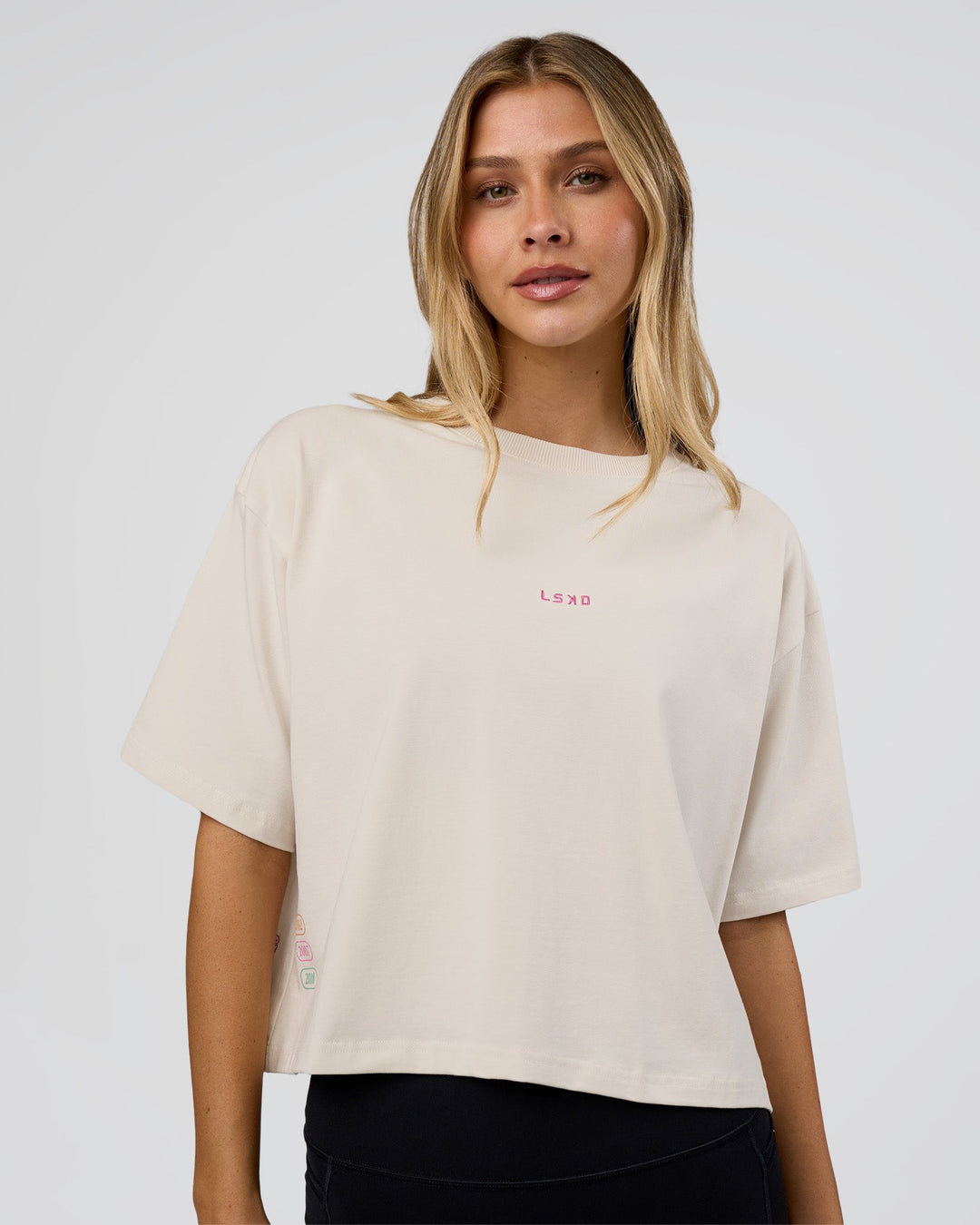 Woman wearing Go-To Heavy Weight FLXCotton Graphic Skimmer Tee - Off White-Multi | Model:Leilani | Size:XS