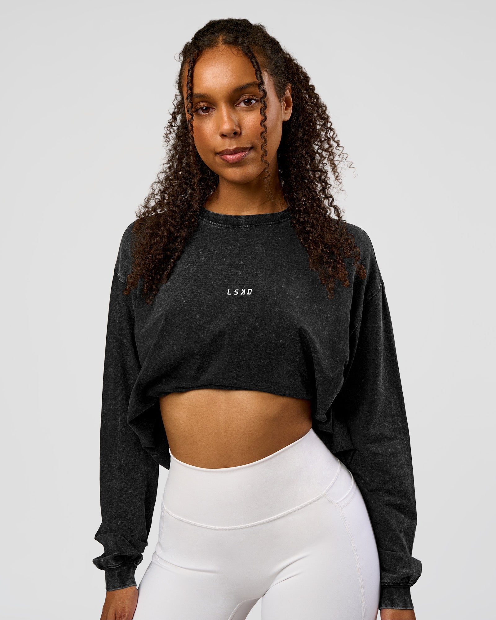 Woman wearing Go-To Long Sleeve FLXCotton Oversized Tee - Black Washed-White | Model:Jordan | SIze:XS
