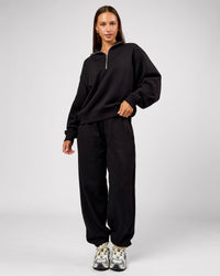 Woman wearing Go-To Oversized Track Pant - Black | Model:Brylee | Size:XS | Thumbnail Index: 1