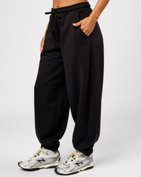 Woman wearing Go-To Oversized Track Pant - Black | Model:Brylee | Size:XS