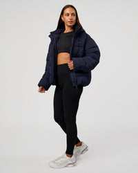 Woman wearing Go-To Puffer Jacket - Future Navy | Model:Brylee | Size:XS | Thumbnail Index: 6