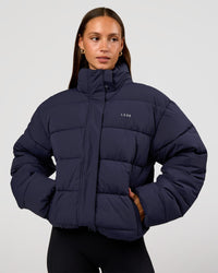 Woman wearing Go-To Puffer Jacket - Future Navy | Model:Brylee | Size:XS | Thumbnail Index: 9
