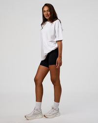 Woman wearing High Run FLXCotton Oversized Tee - White-Jelly Mint | Model:Kirstyn | Size:XS