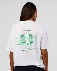 Woman wearing High Run FLXCotton Oversized Tee - White-Jelly Mint | Model:Kirstyn | Size:XS