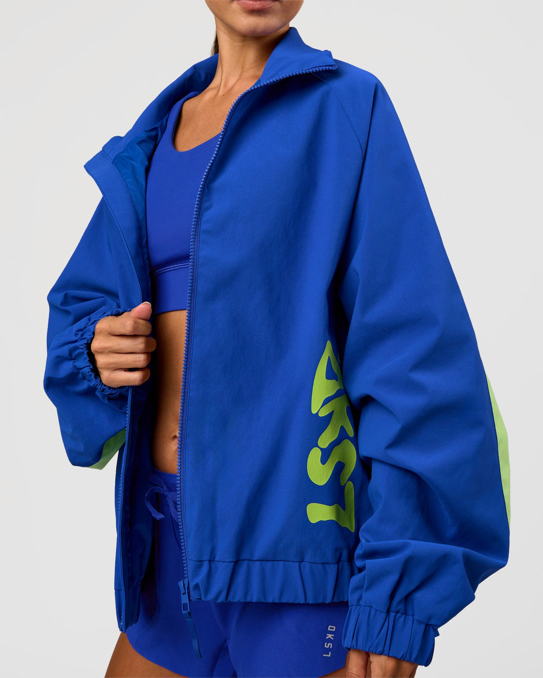 Woman wearing Hype Oversized Track Jacket - Electric Indigo | Model:Brylee | Size:XS - view 9